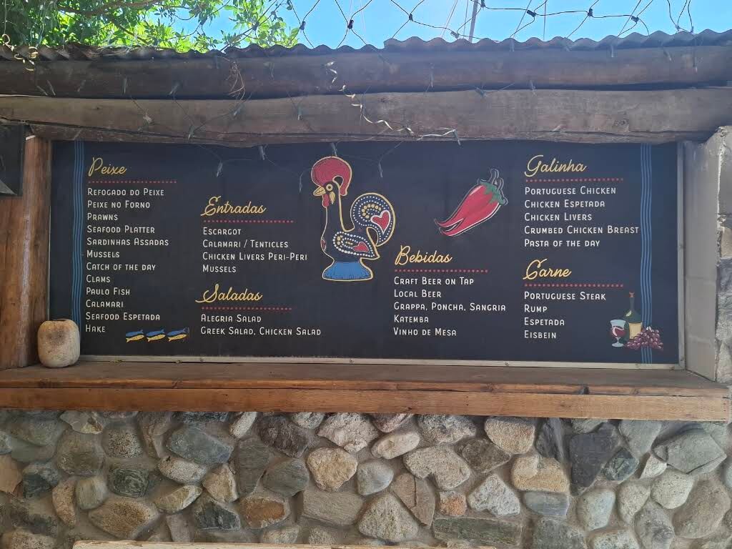 The painted menu board with the Barcelos rooster